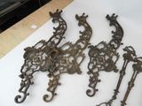 four pieces of antique metal on a table