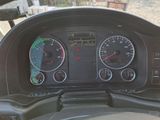 a dashboard of a vehicle with gauges and speedometers