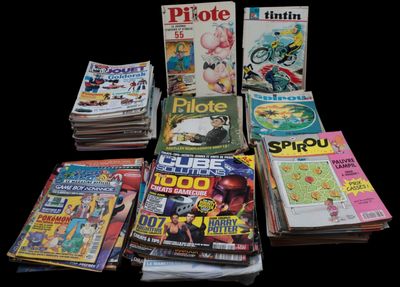 a lot of magazines that are sitting on a table