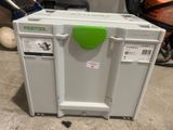 a white and green cooler sitting on the floor