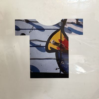 a picture of a t - shirt with a guitar on it