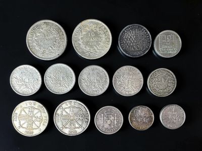 six different types of chinese coins on a black surface