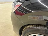 a close up of a car ' s bumper with a sticker on it