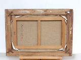 an old wooden easel with a painting on it on a white surface