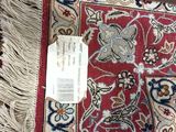 a rug with a tag on it sitting on the floor