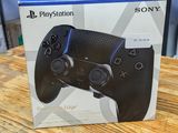 the box of a sony playstation controller sitting on top of a wooden table