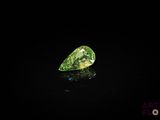 a green diamond on a black background