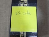 a black box with a yellow sticker on it