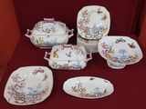 many plates and bowls that are sitting on a table
