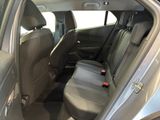 the back seats of a silver car with a black seat belt