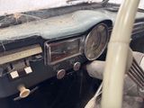 a dashboard of a car with a spider web on it