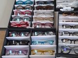 a lot of glasses that are sitting on a table