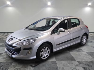 a picture of a silver car parked in a garage