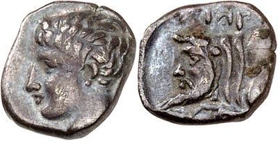 a silver coin with an image of a woman on it