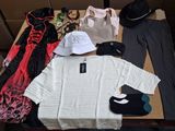 a lot of clothes and a hat on a table
