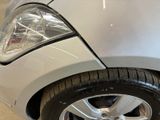 a close up of a car ' s headlight and front bumper