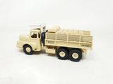 a toy truck that is sitting on a white surface