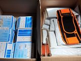 a box with a car inside of it that is filled with boxes