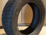 an image of a tire sitting on top of a cardboard box