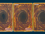three cards that are sitting on top of each other