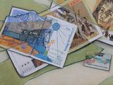 a painting of a bunch of stamps on a table