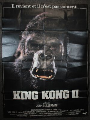 affiche de « King Kong II » représentant un visage de gorille sur fond noir