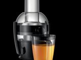 illustration of a juicer and a glass of orange juice on a black background