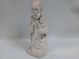 a statue of a man holding a baby on his lap