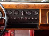 a dashboard of a car with a clock and a steering wheel