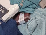 a pile of towels and towels on a table
