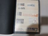 a black book with stamps on it sitting on a table