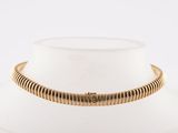 a close up of a necklace on a mannequin neck