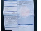 a picture of a receipt with a picture of a house on it