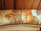 a picture of a couch with a painting on it