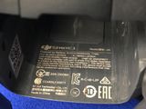 a close up of a printer on a blue carpet