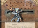 a statue of a man holding a sword on a plaque