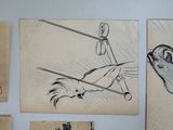 several drawings of a person hanging on a wall in a room