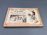 an old book with a picture of a man riding a bicycle