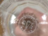 a person holding a glass of water in their hand