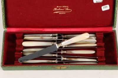 six knives in a box with a knife in it