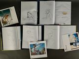 a lot of books that are on a table