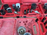 a red tool box with tools in it on a table