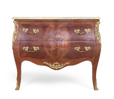 an antique chest of drawers with marble top
