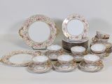 many different types of plates and bowls on the table