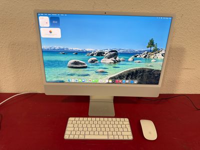 a desktop computer sitting on a desk with a keyboard and mouse