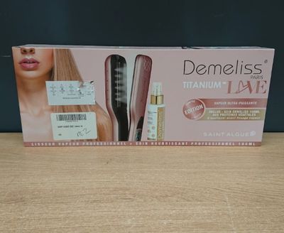 the box is open on a table with a hair straightener in it
