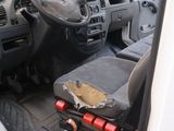 a white truck with a black seat and dashboard