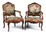 pair of louis xv style carved walnut armchairs with tapestry upholstered seats