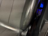 a close up of a car seat with a remote control
