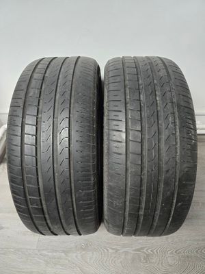 a pair of tires on a wooden floor next to a wall